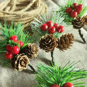 Artificial pine needles with red berries and pine cones for Christmas DIY decor