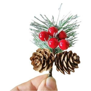 Artificial pine branch with red berries and pinecones for Christmas tree decor