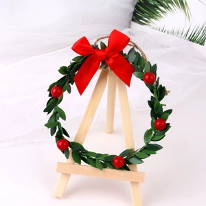 Mini Christmas wreath with red berries, green leaves, silk bow and hemp rope hanger