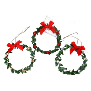 Set of three Christmas wreaths with red, gold, and silver berries and festive ribbons