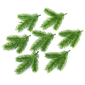 Artificial pine branches for Christmas wreaths and DIY floral greenery decoration
