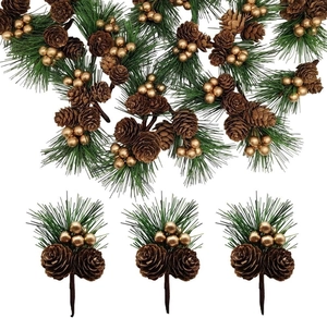 Close-up of artificial pine picks with golden berries and pine cones for holiday decor