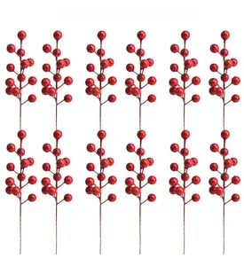 Close-up of 12 artificial red holly berry branches for Christmas and New Year decor