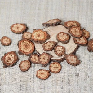 Natural dried red vine wood slices with radial grain for rustic wreaths and crafts