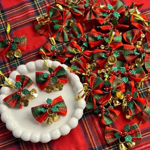Christmas plaid ribbon bows with gold bells and holly berries for festive tree decoration