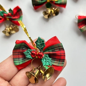 Plaid Christmas bow ornament with golden bells and green leaf detail for Xmas tree decor