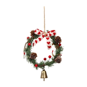 Christmas wreath with pine needles, cones, red berries, fabric bow and vintage bell