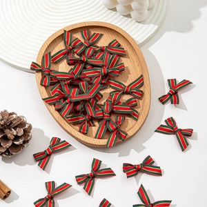 Handmade red green gold striped Christmas bows for holiday gift wrapping and DIY crafts