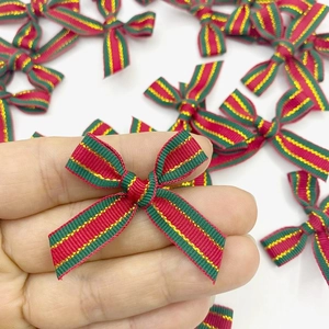 Miniature handmade Christmas striped bows for gift wrapping and DIY festive decorations