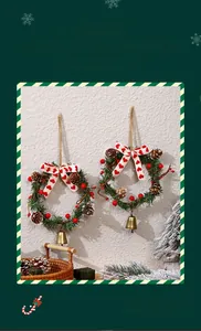 Detail of Christmas wreath pendants with pine cones, red berries and festive metal bells