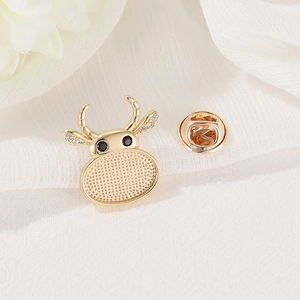 Golden cartoon ox head brooch with sparkling zircon details and secure butterfly clasp pin