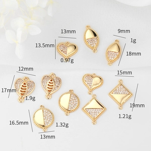 Macro view of gold-plated celestial charms with white cubic zirconia and specifications