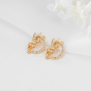 Detailed view of gold-plated fairy moon connectors with cubic zirconia for DIY jewelry