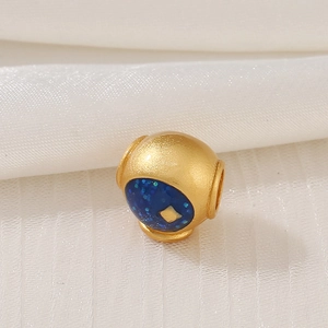 Golden spherical bead charm with deep blue glitter enamel and matte frosted texture