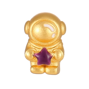 Golden astronaut pendant with purple star charm and matte finish celestial jewelry