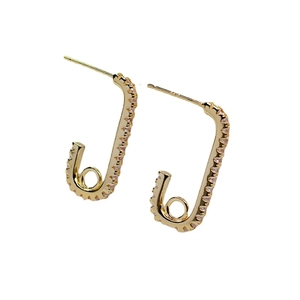 Chic gold safety pin earrings with sparkling white crystals on a clean white background