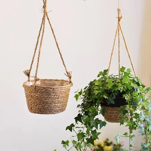 Hanging woven seagrass planter basket with waterproof lining for indoor plant display