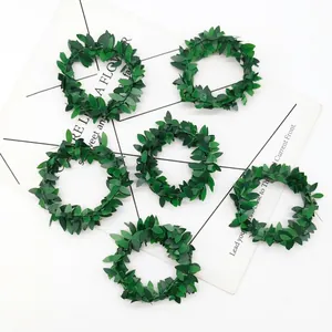 Set of 6 Christmas green leaf napkin rings with artificial foliage for table setting
