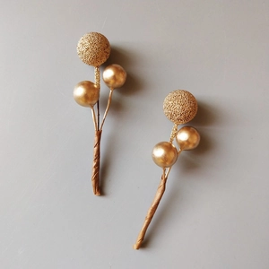Golden Christmas berry picks with matte and glossy beads for festive wreaths and DIY crafts