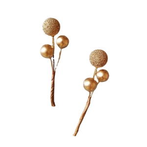 Golden berry decorative branches with matte frosted and glossy spheres for Christmas decor
