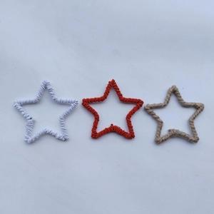 Three-piece set of star-shaped Christmas ornaments in white, red, and jute twine finish