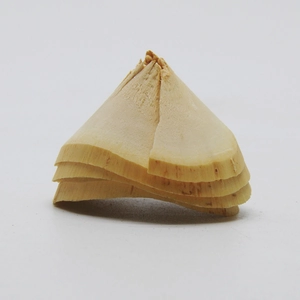 Macro detail of natural wood curls showing fibrous texture for creative DIY Christmas wreaths