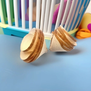 Detailed close-up of handmade wooden spiral gnawing toys for hamsters and small pets