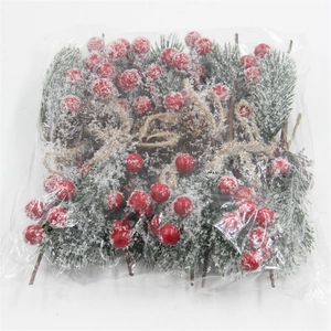 Detailed view of artificial Christmas berry picks with pine cones and faux snow in packaging