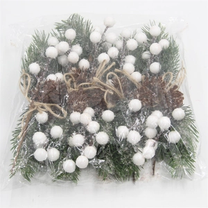 Detail of Christmas artificial greenery bundle with frosted berries and pine cones