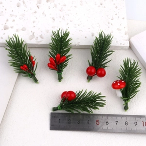 Set of 5 artificial pine needles with red berries and mushrooms shown against a ruler for size