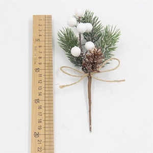 Close-up of a 15cm Christmas pine needle bouquet with white berries and a natural pinecone