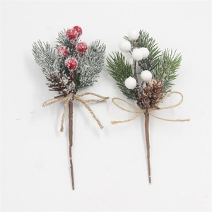 Detail of frosted Christmas pine pick with red berries, pine cones and twine bow decoration