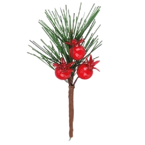 Detail of decorative pine needles branch with vibrant red berries for Christmas decor