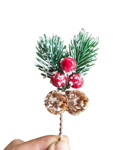 Detail of Christmas pick with snowy pine needles, red berries and mini pinecones