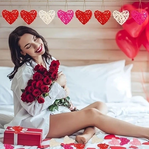 Rattan heart-shaped ornaments in red, pink, and white for Valentine's Day decor