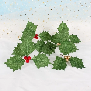 Artificial Christmas holly leaves with vibrant red and champagne gold berries for decor