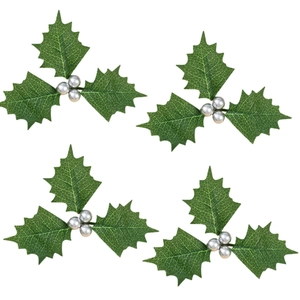 Set of four artificial Christmas holly leaves with silver berries on white background
