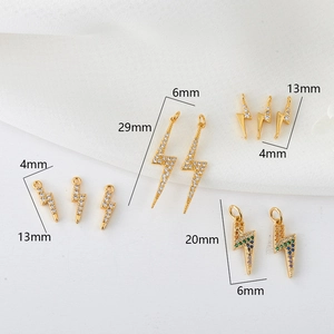 Detailed view of lightning bolt pendants with micro-pave zircons in 14K gold plating