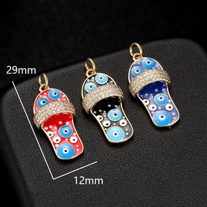 Detail view of 29mm Evil Eye slipper pendants with crystals and colorful enamel finish