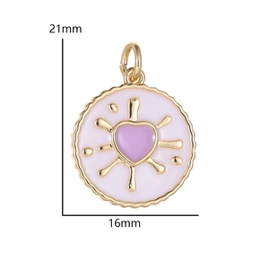 Macro detail of a 21mm round heart charm with pink enamel and gold-plated finish