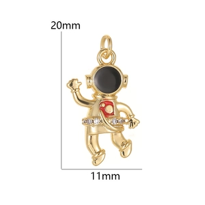 Golden astronaut pendant with black enamel and zircons, dimensions 20mm by 11mm