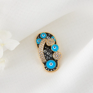 Golden flip-flop pendant with blue evil eye enamel and shimmering zircons for DIY jewelry
