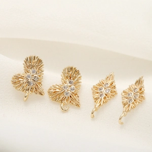 Gold heart and diamond shaped jewelry pendants with zircon inlays and textured finish