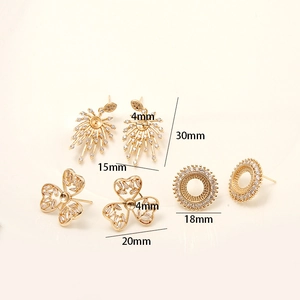 Golden earrings settings with zircon and pearl mountings in flower and clover designs
