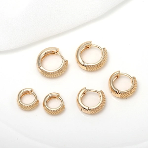 Three pairs of 14k gold-plated hoop earrings with smooth and beaded texture finish