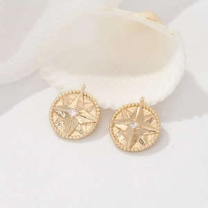 Ζευγάρι χρυσά στρογγυλά μενταγιόν 14K με αστέρι και ένθετη πέτρα ζιργκόν