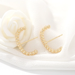 Elegant 925 silver needle gold C-shaped beaded hoop earrings on white silk fabric