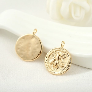 14k gold plated round coin pendant featuring a relief bee pattern and hammered texture