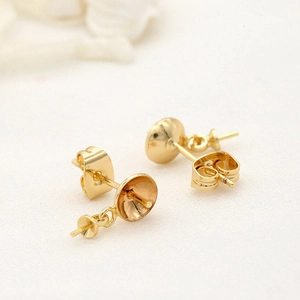 Pair of 14k gold-plated pearl stud earring settings with bowl pins and butterfly backs