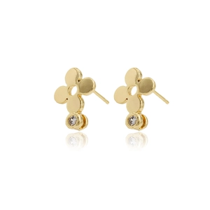 Golden flower earrings with zircon drop on a reflective white background